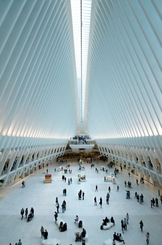 Modern architectural view of the Oculus in NYC, showcasing its futuristic design and bustling interior.