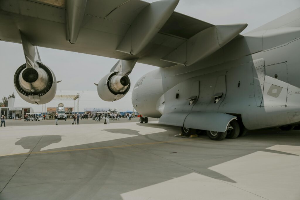 Close-up of C-17 Globemaster on display at outdoor airforce event showcasing aviation technology.